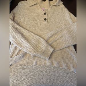 Cream color sweater. Shorter in front than back. Great condition.